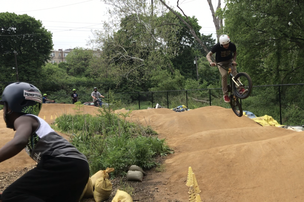 IMG_6605-1 Riders on the Philly Pump Track in West Fairmount Park. It's free, and has bikes and helmets to borrow. (Photo: Michael Kasama)