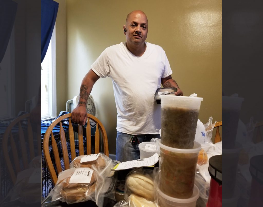 Medicaid-Food9 Feliciano Pagan, a Medicaid recipient in Philadelphia, looks over his medically tailored meals made at the kitchens of the nonprofit MANNA and paid for by Health Partners Plans, his Medicaid health plan.