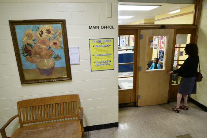 A replica of the Sunflowers, by Vincent van Gogh (1853-1890, the Netherlands) hangs in the hallway of Edward Gideon Elementary School, next to the Main Office. (Bastiaan Slabbers for WHYY)