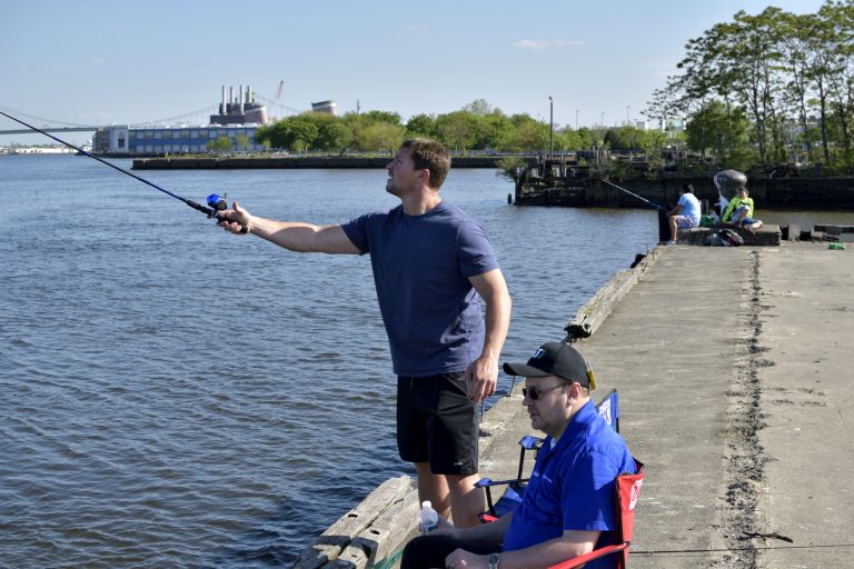 Fishermen Dustin and John at Pier 60 on the Delaware waterfront, near Tasker Street, in South Philadelphia, PA, on May 12, 2018. (Bastiaan Slabbers/for WHYY)