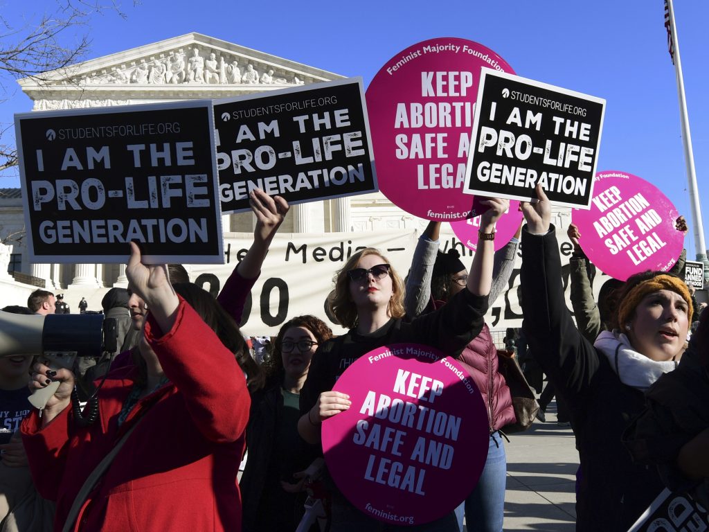 Protesters on both sides of the abortion issue gather outside the Supreme Court in Washington on Jan. 19 during the March for Life. Protesters on both sides of the abortion issue gather outside the Supreme Court in Washington on Jan. 19 during the March for Life. (Susan Walsh/AP)