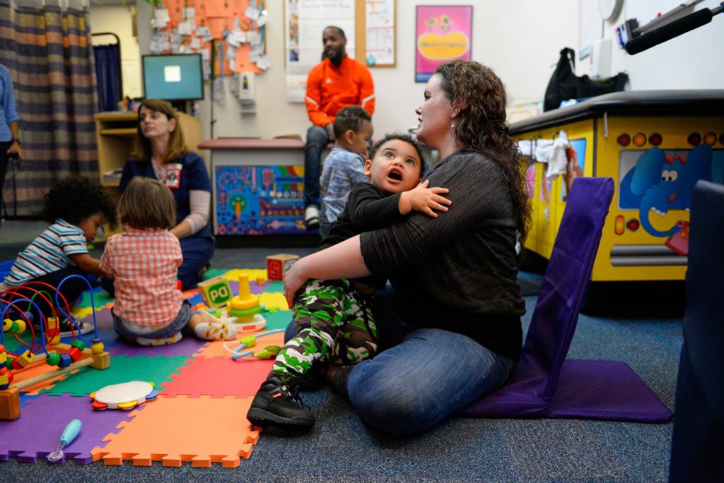 Kelly Zimmerman holds her son Jaxton Wright at a parenting session at the Children’s Health Center in Reading, Pa. The free program provides resources and social support to new parents in recovery from addiction, or who are otherwise vulnerable.