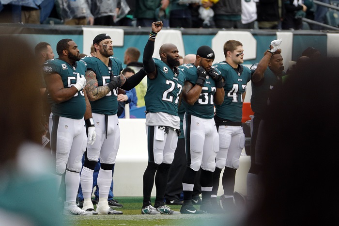 Philadelphia Eagles' Malcolm Jenkins (27) raises his fist during the playing of the national anthem ahead of an NFL football game against the San Francisco 49ers, Sunday, Oct. 29, 2017, in Philadelphia. (AP Photo/Chris Szagola)