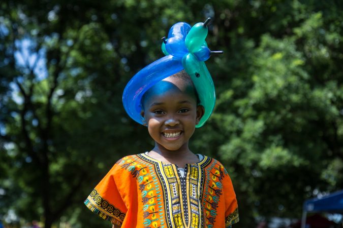 Bailey Mercedat, 4, received a balloon crown at an Eid al-Fitr celebration, marking the end of Ramadan. (Kimberly Paynter/WHYY)