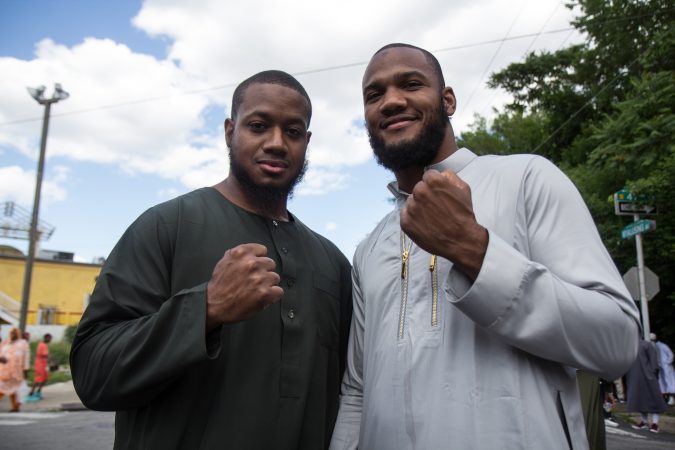 Samir Salahubdin, and Julian Williams, boxers in West Philadelphia, put up their fists during an Eid al-Fitr celebration, marking the end of Ramadan. (Kimberly Paynter/WHYY)