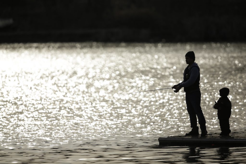 Pennsylvania Daily Life A father and son fish at Meadow Lake in Franklin Delano Roosevelt Park, Monday, March 16, 2015, in Philadelphia. (AP Photo/Matt Slocum)