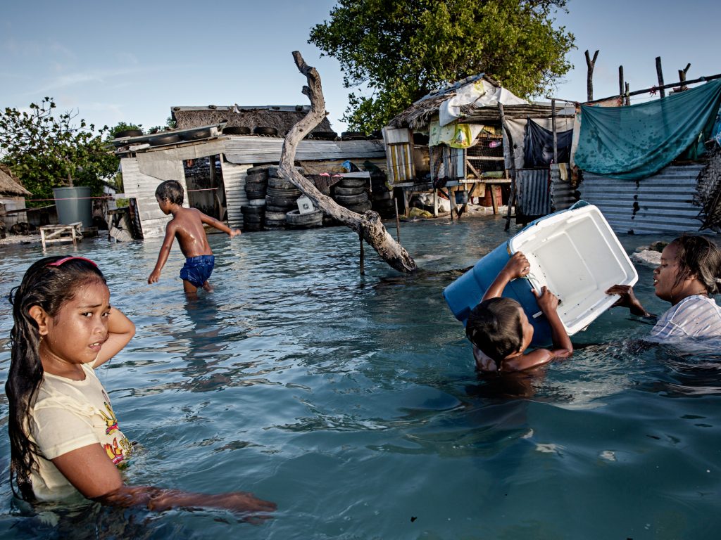 In Kiribati, an island republic in the Central Pacific, large parts of the village Eita (above) have succumbed to flooding from the sea. In Kiribati, an island republic in the Central Pacific, large parts of the village Eita (above) have succumbed to flooding from the sea. (Jonas Gratzer/LightRocket via Getty Images)