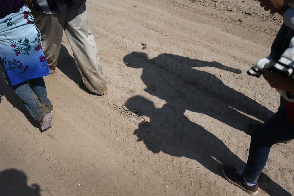 Central American immigrant families walk after crossing from Mexico into the United States to seek asylum in Texas. Central American immigrant families walk after crossing from Mexico into the United States to seek asylum in Texas. (John Moore/Getty Images)