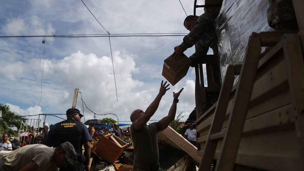 U.S. Army soldiers in Puerto Rico unload food on Oct. 17, 2017. Nearly a month after Hurricane Maria hit, the federal government was still delivering basic supplies, like food and water. U.S. Army soldiers in Puerto Rico unload food on Oct. 17, 2017. Nearly a month after Hurricane Maria hit, the federal government was still delivering basic supplies, like food and water. (Mario Tama/Getty Images)