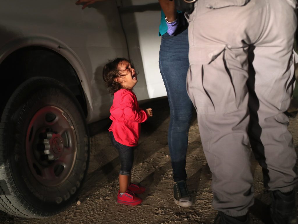 A 2-year-old Honduran girl cries as her mother, who seeks asylum, is detained at the Southern border near McAllen, Texas, in June. A 2-year-old Honduran girl cries as her mother, who seeks asylum, is detained at the Southern border near McAllen, Texas, in June. (John Moore/Getty Images)