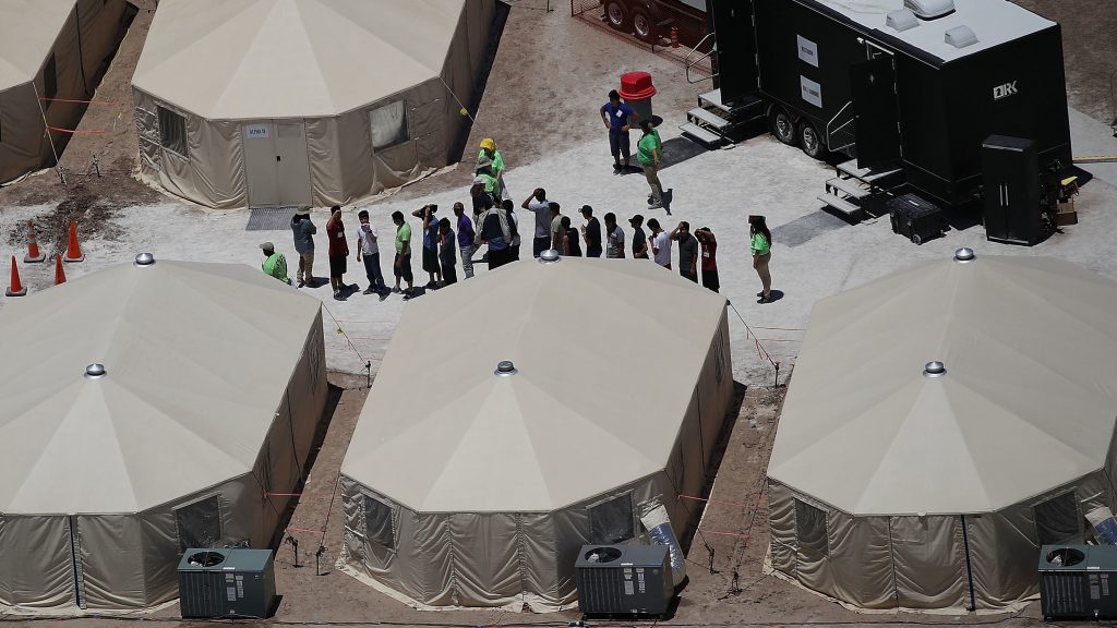 Children and workers are seen at a tent encampment on June 19, 2018 in Tornillo, Texas. The Trump administration is using the tent facility to house immigrant children separated from their parents. Children and workers are seen at a tent encampment last week n Tornillo, Texas. The Trump administration was using the tent facility to house immigrant children separated from their parents. (Joe Raedle/Getty Images)