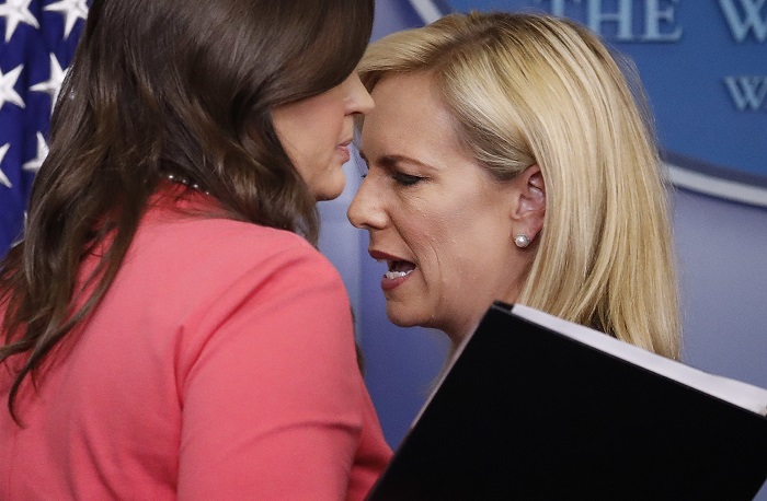 Sarah Huckabee Sanders, Kirstjen Nielsen Homeland Security Secretary Kirstjen Nielsen, right, and White House press secretary Sarah Huckabee Sanders, left, talk as they switch places at the podium during the daily briefing in the Brady Press Briefing Room of the White House, Monday, June 18, 2018. (AP Photo/Pablo Martinez Monsivais)