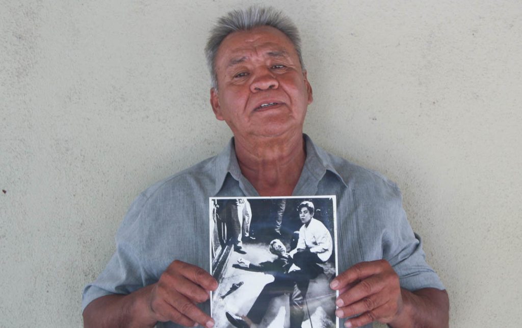 Juan Romero, 67, at his home in Modesto, Calif., holds a photo of himself and Sen. Robert F. Kennedy, taken by The Los Angeles Times’ Boris Yaro on June 5, 1968. Juan Romero, 67, at his home in Modesto, Calif., holds a photo of himself and Sen. Robert F. Kennedy, taken by The Los Angeles Times' Boris Yaro on June 5, 1968. (Jud Esty-Kendall/StoryCorps)