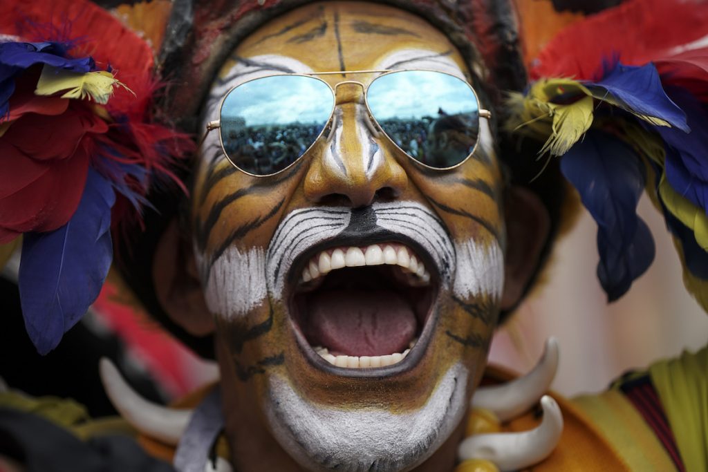 Colombian soccer fan Jose Florentino poses for photos ahead of the 2018 soccer World Cup at a square downtown Moscow, Russia, Wednesday, June 13, 2018. (AP Photo/Felipe Dana)