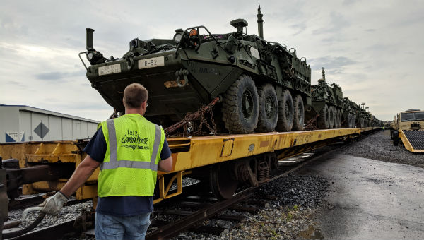 stryker_rail1 Stryker vehicles are loaded on rail cars at Naval Support Activity, Mechanicsburg to be transported to the National Training Center on June 20, 2018. (Rachel McDevitt/WITF)