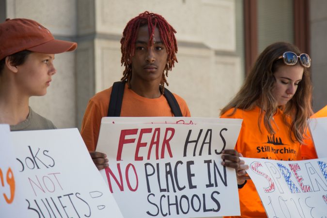 Khalil Lewis-Ra, 14, (center) helped organize the 