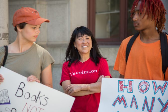 Congresswoman, Helen Gym, stands with the student organizers of 