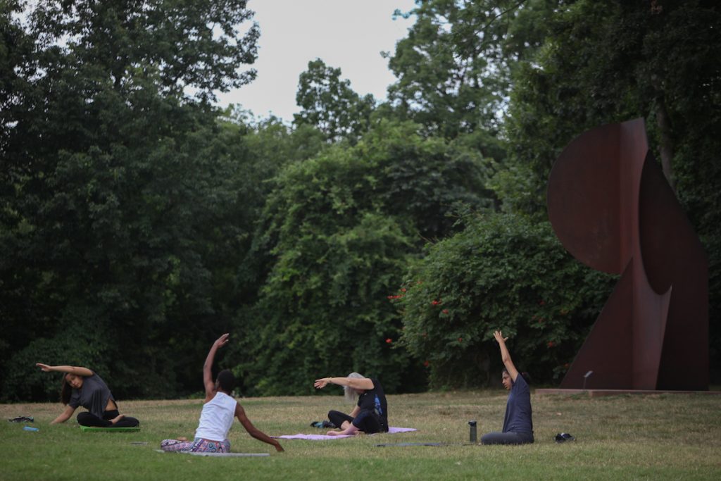 07 21 2018-ecohen-delaware art museum-20 Locals gather in in the Copeland Sculpture Garden at the Delaware Art Museum for some morning yoga. (Emily Cohen for WHYY)