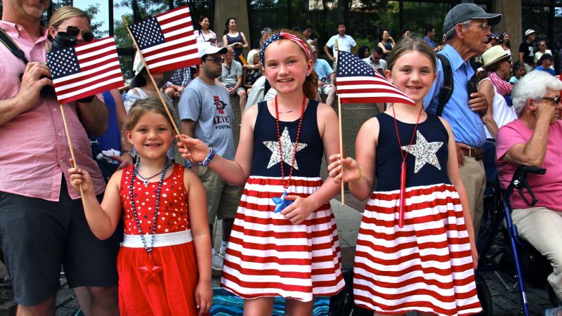 The Sweeney sisters (from left), Meika, 5, Maddison, 10, and Morgan, 7, traveled from Seattle to celebrate Independence Day in Philadelphia. (Emma Lee/WHYY)