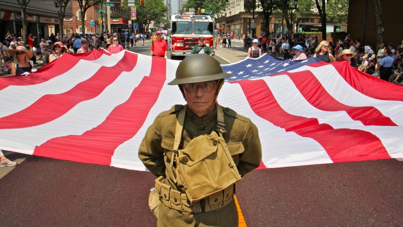 Barry Johnson, marching with the Daughters of the American Revolution, wears an authentic World War I uniform to commemorate the 100th anniversary of the war. (Emma Lee/WHYY)