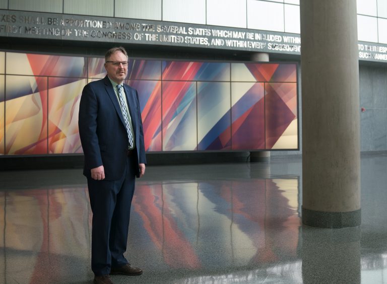 Acting U.S. Census Bureau Director Ron Jarmin stands in the lobby of the agency's headquarters in Suitland, Md. The bureau is facing six lawsuits from more than two dozen states and cities, plus other groups, that want a new question about U.S. citizenship removed from the 2020 censu