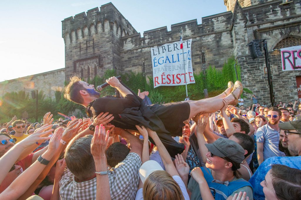 2018-07-14-j wilson Edith Piaf John Jarboe-Philadelphia-Fairmount-Bastille Day-1 John Jarboe, portraying Edith Piaf, crowd surfs off of the stage at the conclusion of the Bastille Day celebration at Eastern State Penitentiary.