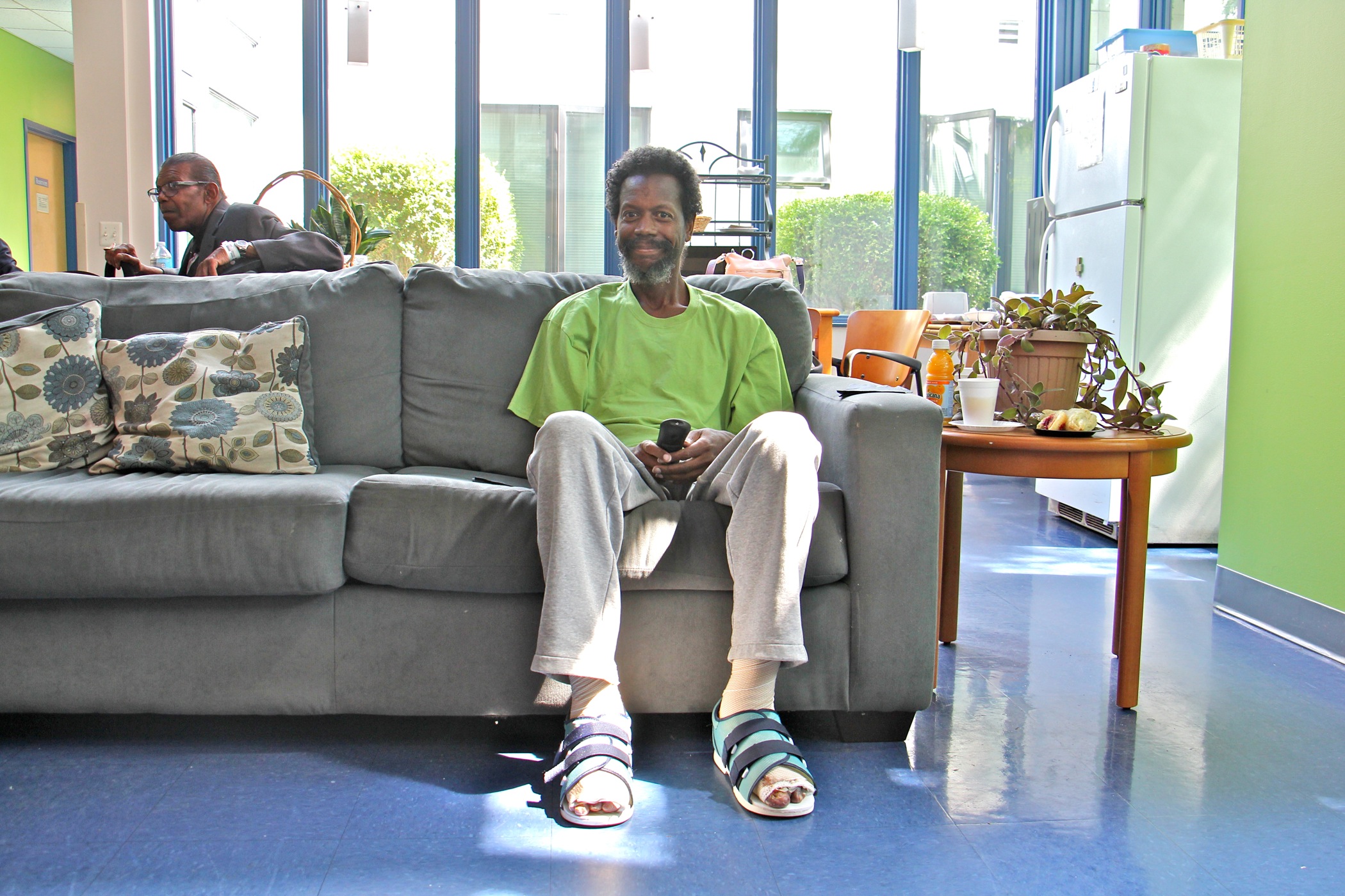 Rodney Lane, 57, relaxes in the common room at Serenity Court. After hospital treatment for frostbite and pneumonia, Lane was discharged to Serenity Court so he could get the continuing treatment he requires.