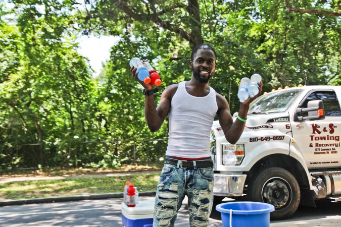 A man sells water and Gatorade in Fairmount Park in the midst of a heat wave with temperatures in the mid- to upper 90s expected throughout the week. (Kimberly Paynter/WHYY)