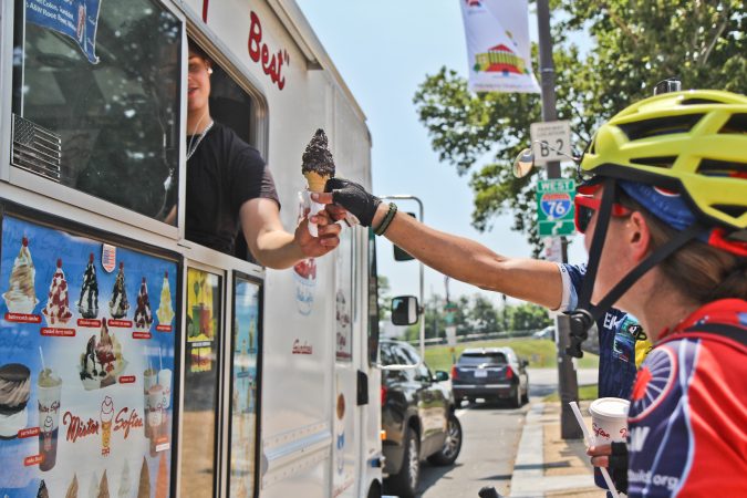 Cyclists purchase ice cream after a ride from Wilmington to Philadelphia. (Kimberly Paynter/WHYY)
