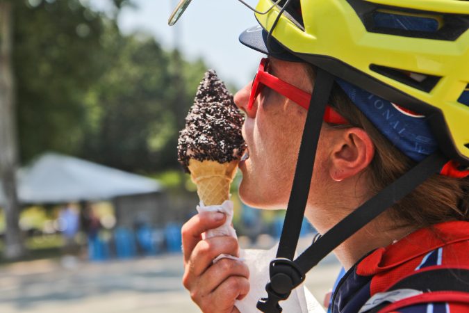 Cyclist Beth Hayley enjoys an ice cream after a ride from Wilmington to Philadelphia. (Kimberly Paynter/WHYY)