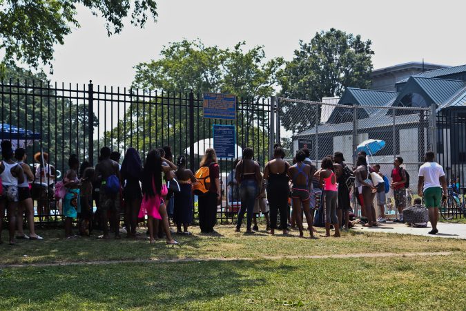 The line to get into the John B. Kelly Pool indicates an hour wait during an historic heat wave in Philadelphia. (Kimberly Paynter/WHYY)