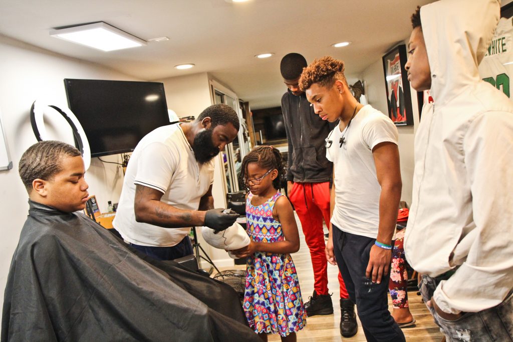2018 7 23 k paynter alex-2 P. Micheal Boone instruct Jr. Barber Academy students in the art of the shape up during the second week of class. (Kimberly Paynter/WHYY)