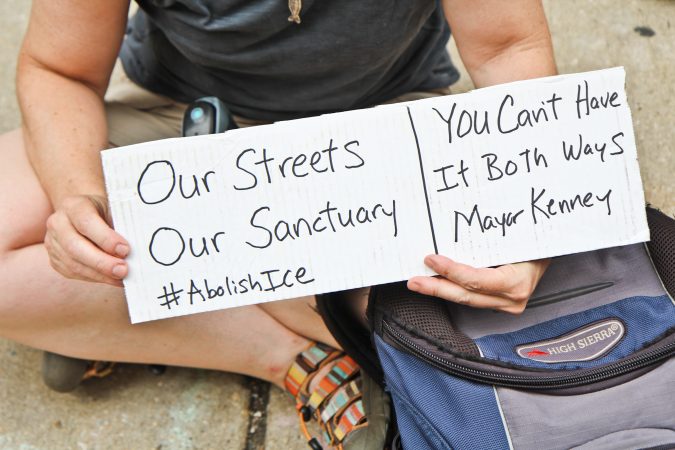 File photo: Immigration policy protesters have moved from the ICE HQ building at 8th and Cherry street to City Hall and are asking Philadelphia Mayor Jim Kenney to end the Pars agreement. (Kimberly Paynter/WHYY)