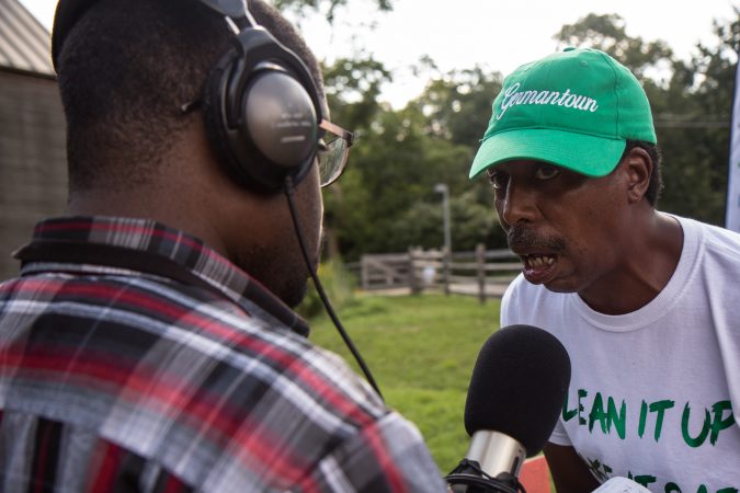 Keith Shenck, from Germantown, shares his experience with violence at the the WURD event at Bartram’s Garden. (Kimberly Paynter/WHYY)
