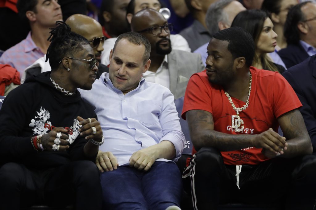 Michael Rubin, Lil Uzi Vert, Meek Mill In this May 7, 2018 photo, Philadelphia 76ers' co-owner Michael Rubin, center, talks with rappers Lil Uzi Vert, left, and Meek Mill during the first half of Game 4 of an NBA basketball second-round playoff series against the Boston Celtics in Philadelphia. (AP Photo/Matt Slocum)
