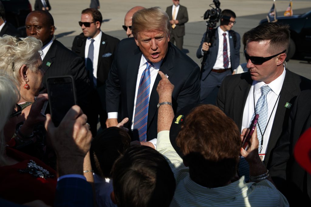 Donald Trump President Donald Trump greets supporters after arriving at the Greenbrier Valley Airport in Lewisburg, W.Va., before attending a