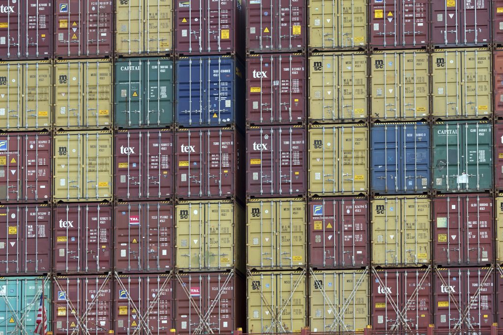 US China Tariffs In this Thursday, July, 5, 2018 photo, a bay of 40-foot shipping container fill the stern of a container ship at the Port of Savannah in Savannah, Ga. The United States and China launched what Beijing called the