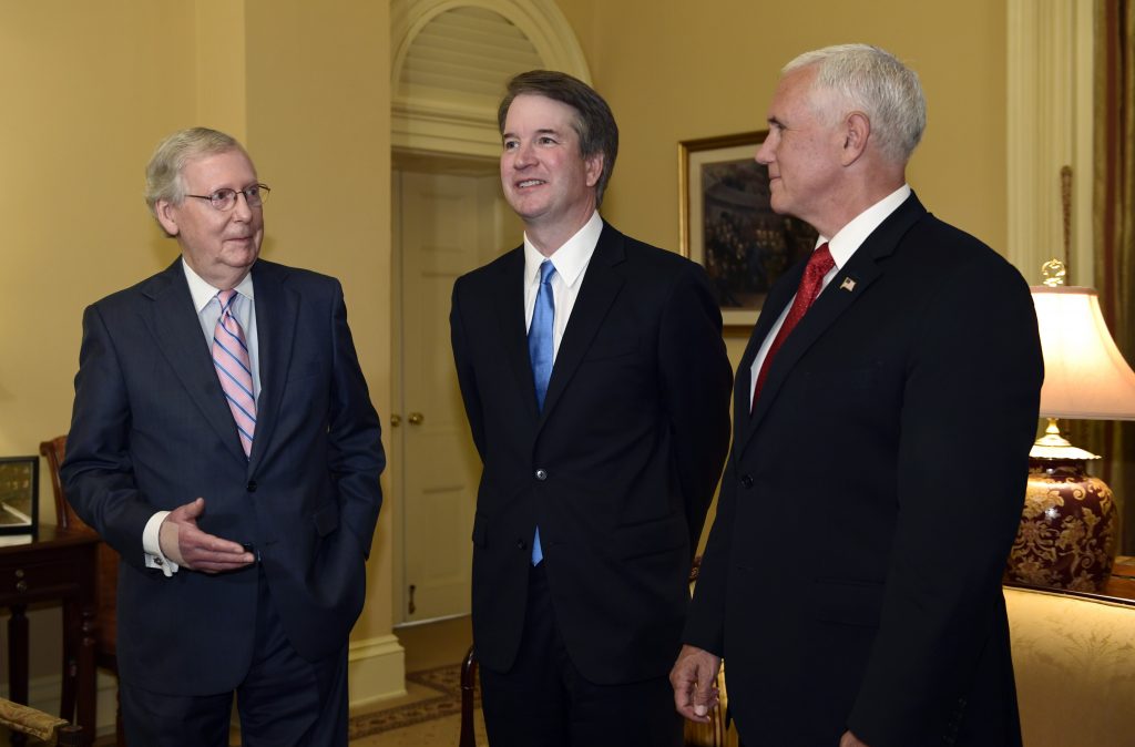 Mitch McConnell, Mike Pence, Brett Kavanaugh Senate Majority Leader Mitch McConnell of Ky., (left), speaks as he talks about Supreme Court nominee Brett Kavanaugh, (center), as Vice President Mike Pence, (right), listens, during a visit Capitol Hill in Washington, Tuesday, July 10, 2018. Kavanaugh is on Capitol Hill to meet with Republican leaders as the battle begins over his nomination to the Supreme Court. (Susan Walsh/AP Photo)