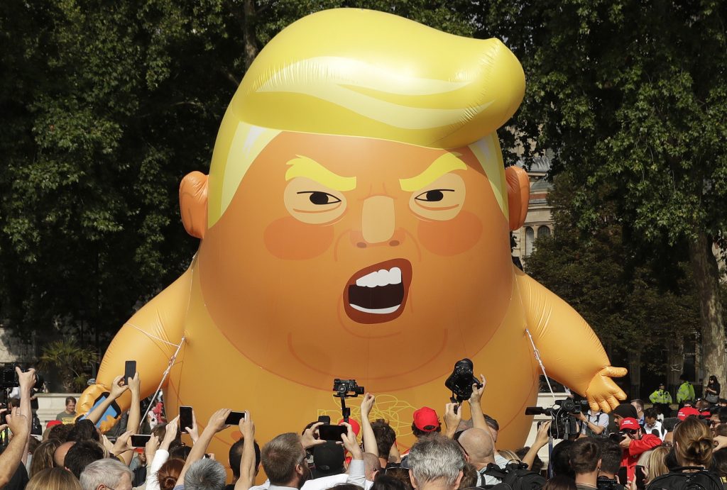 Britain Trump Visit A six-meter high cartoon baby blimp of U.S. President Donald Trump is flown as a protest against his visit, in Parliament Square in London, England, Friday, July 13, 2018. Trump is making his first trip to Britain as president after a tense summit with NATO leaders in Brussels and on the heels of ruptures in British Prime Minister Theresa May's government because of the crisis over Britain's exit from the European Union. (Matt Dunham/AP Photo)