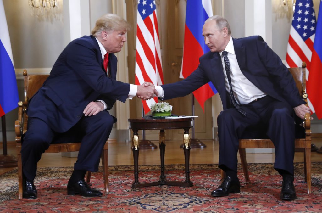 Donald Trump, Vladimir Putin U.S. President Donald Trump, left, and Russian President Vladimir Putin shake hand at the beginning of a meeting at the Presidential Palace in Helsinki, Finland, Monday, July 16, 2018. (