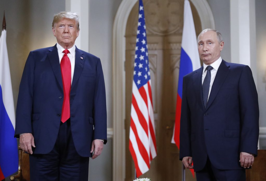Donald Trump, Vladimir Putin President Donald Trump and Russian President Vladimir Putin pose for a photograph at the beginning of a one-on-one meeting at the Presidential Palace in Helsinki, Finland. (AP Photo/Pablo Martinez Monsivais)