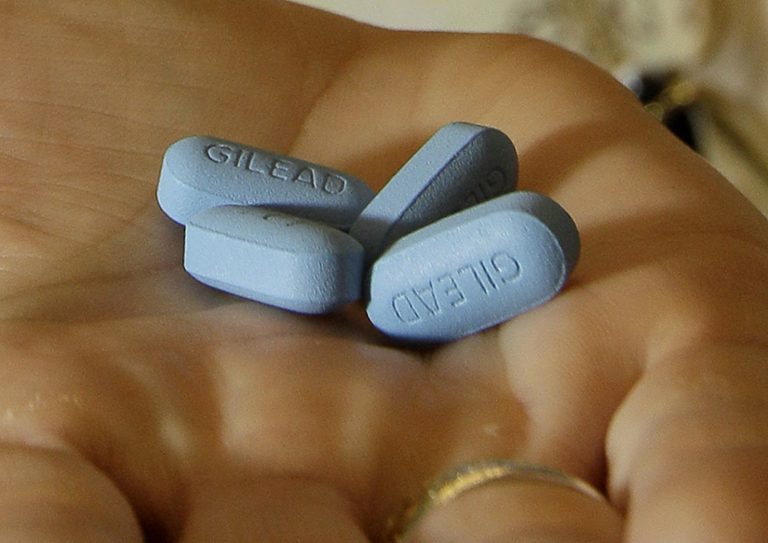 FILE - In this May 10, 2012, file photo, a doctor holds Truvada pills at her office in San Francisco. New research shows more promise for using AIDS treatment drugs, such as Truvada, as a prevention tool, to help keep uninfected people from catching HIV during sex with a partner who has the virus. Truvada has been shown to help prevent infection when one partner has the virus and one does not, but the evidence so far has been strongest for male-female couples. (AP Photo/Jeff Chiu, File)