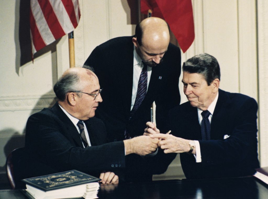 Ronald Reagan, Mikhail Gorbachev In this Dec. 8, 1987 file photo U.S. President Ronald Reagan, (right), and Soviet leader Mikhail Gorbachev exchange pens during the Intermediate Range Nuclear Forces Treaty signing ceremony in the White House East Room in Washington, D.C. Gorbachev's translator Pavel Palazhchenko stands in the middle. Pavel Palazhchenko was a constant presence as chief interpreter for Soviet leader Mikhail Gorbachev and Foreign Minister Eduard Shevardnadze, and watched from Moscow to see how the latest chapter in the US-Soviet story would unfold. (Bob Daugherty/AP Photo, File)