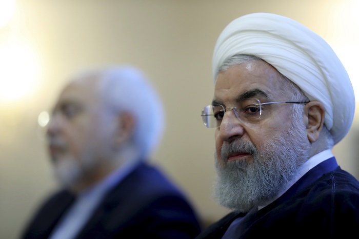 Iran US In this photo released by official website of the office of the Iranian Presidency, President Hassan Rouhani attends a meeting with a group of foreign ministry officials in Tehran, Iran, Sunday, July 22, 2018. Rouhani warned President Donald Trump against provoking his country while indicating peace between the two nations might still be possible. (Iranian Presidency Office via AP)