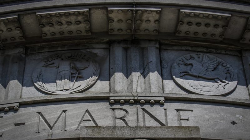 The names of World War I battles and medallions of the armed forces are carved around the top of the Atlantic City monument. (Anthony Smedile for WHYY)