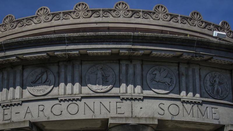 The names of World War I battles and medallions of the armed forces are carved around the top of the Atlantic City monument. (Anthony Smedile for WHYY)