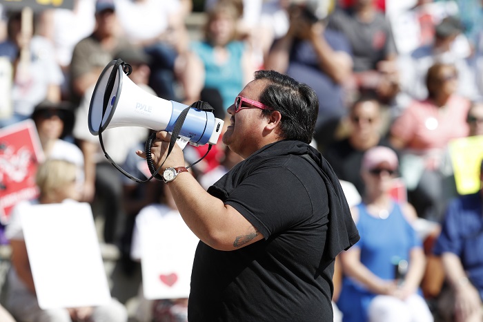 Victor Galvan, r m Victor Galvan uses a bullhorn to lead chants during an immigration rally and protest in Civic Center Park Saturday, June 30, 2018, in downtown Denver. The protest was one of hundreds staged nationwide that has brought liberal activists, parents and first-time protesters--motivated by accounts of children separated from their parents at the US-Mexico border--to press President Donald Trump to reunite families quickly. (AP Photo/David Zalubowski)
