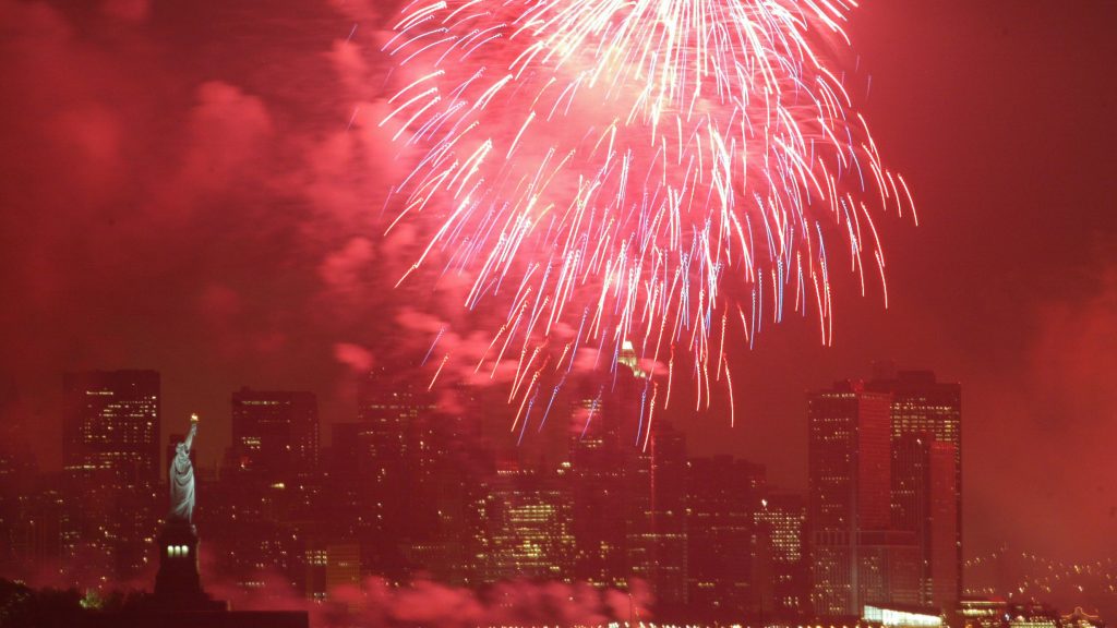 The sky surrounding the Statue of Liberty in New York is lit red by a firework in 2005. Nearly all the fireworks consumers will purchase this year — and 70 percent of those used by professionals — are manufactured in China. The sky surrounding the Statue of Liberty in New York is lit red by a firework in 2005. Nearly all the fireworks consumers will purchase this year — and 70 percent of those used by professionals — are manufactured in China. (Mel Evans/AP)