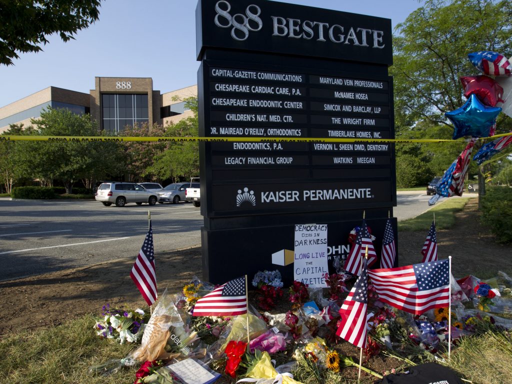 A makeshift memorial is seen at the scene outside the office building housing The Capital Gazette newspaper in Annapolis, Md., on Sunday. A makeshift memorial is seen at the scene outside the office building housing The Capital Gazette newspaper in Annapolis, Md., on Sunday.