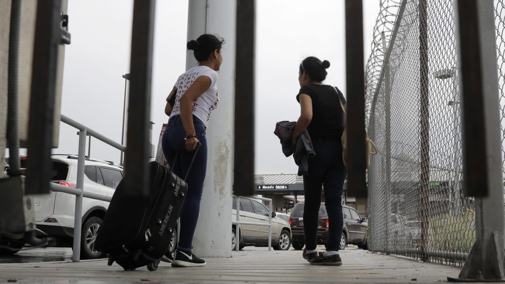 Sisters from Guatemala seeking asylum, cross a bridge to a port of entry in to the United States from Matamoros, Mexico, in Brownsville, Texas. Sisters from Guatemala seeking asylum, cross a bridge to a port of entry in to the United States from Matamoros, Mexico, in Brownsville, Texas. (Eric Gay/AP)